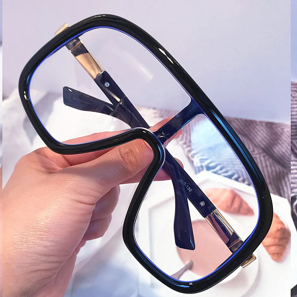 Side view of oversized blue light glasses displaying metal and PC frame.