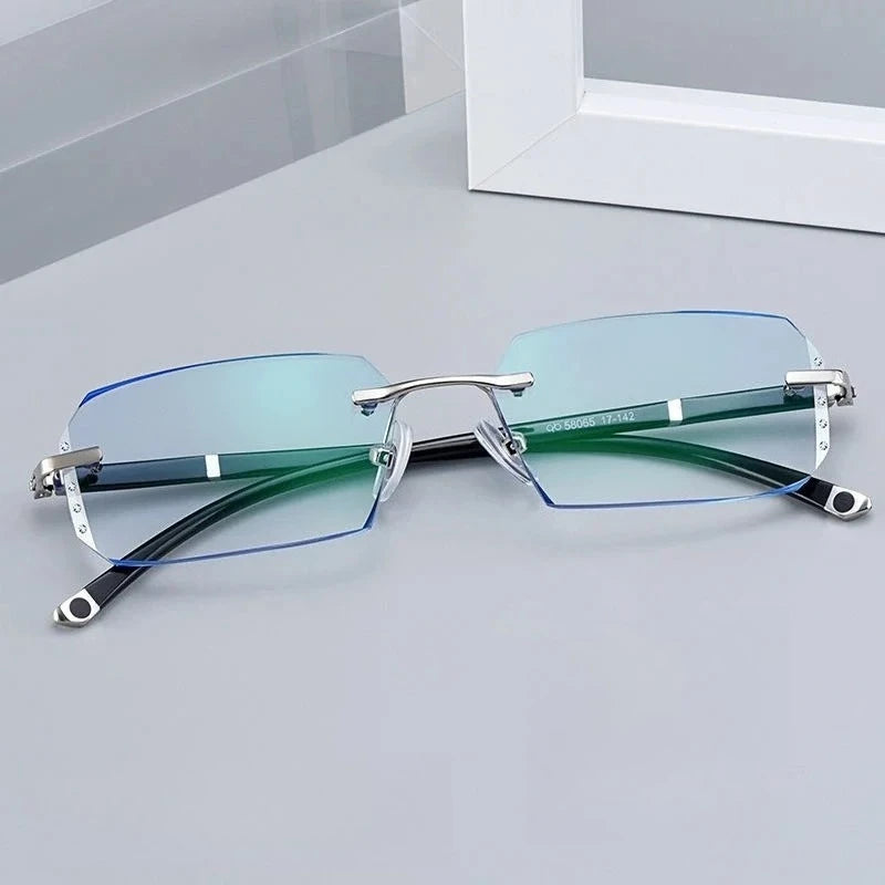 Top view of frameless glasses with blue and green tinted lenses