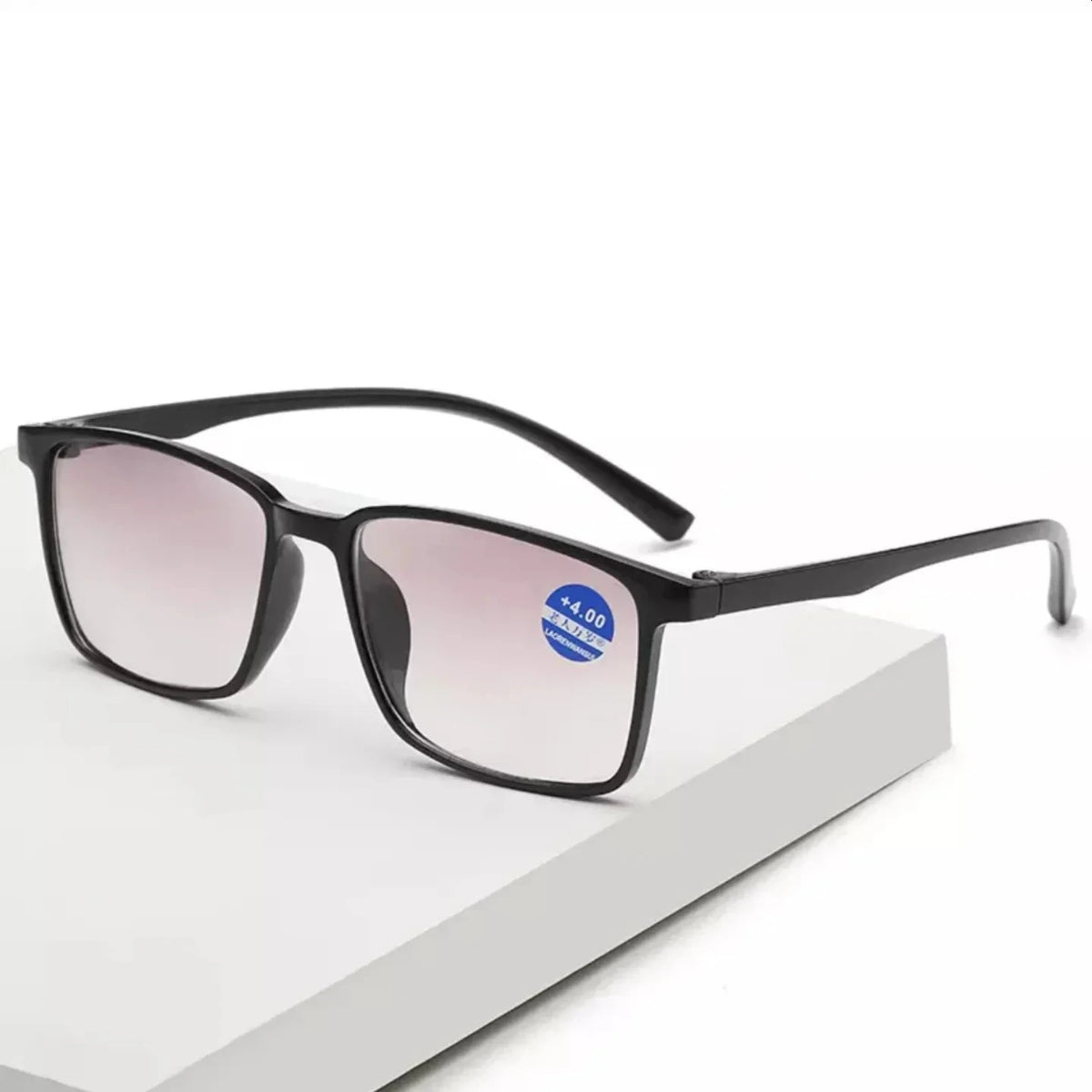 Blue light blocking bifocal reading glasses with black frames on a white surface