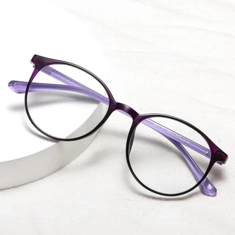 Purple frame anti-blue light reading glasses on white surface