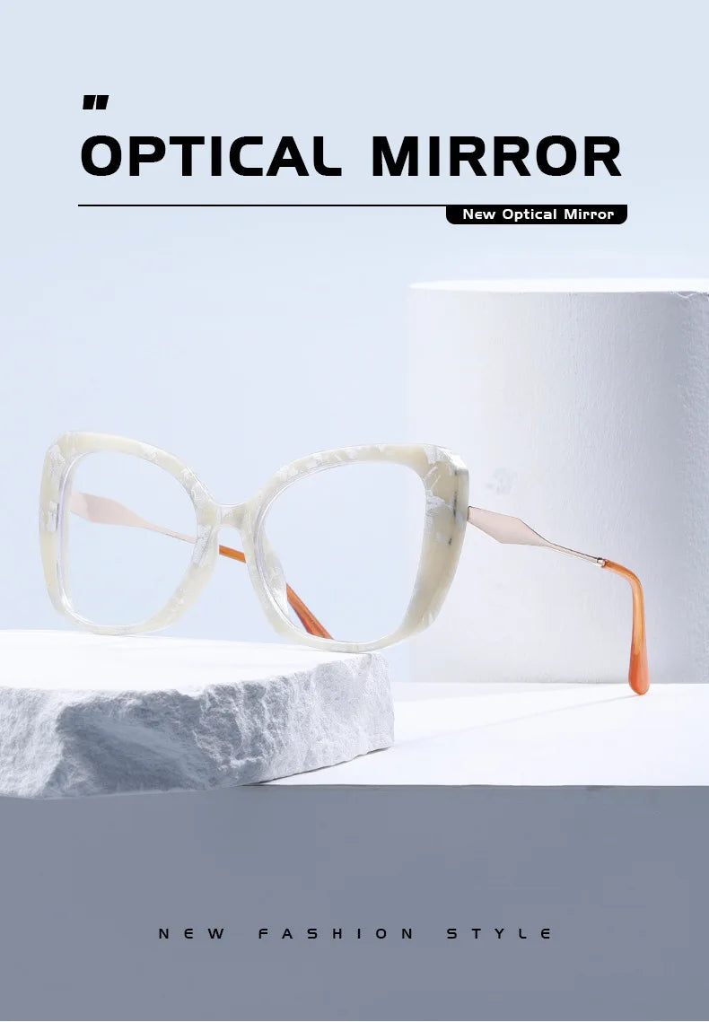 Marbled white square glasses with orange temple tips styled on white stone display