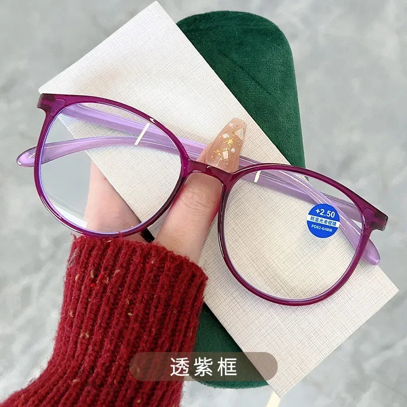 Purple round frame reading glasses showcased on hand