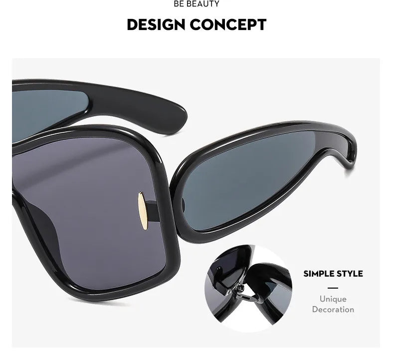 Closeup of black oversized sunglasses showing unique hinge and lens details