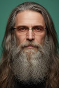 Man wearing rimless bifocal reading glasses with clear lenses and long gray hair