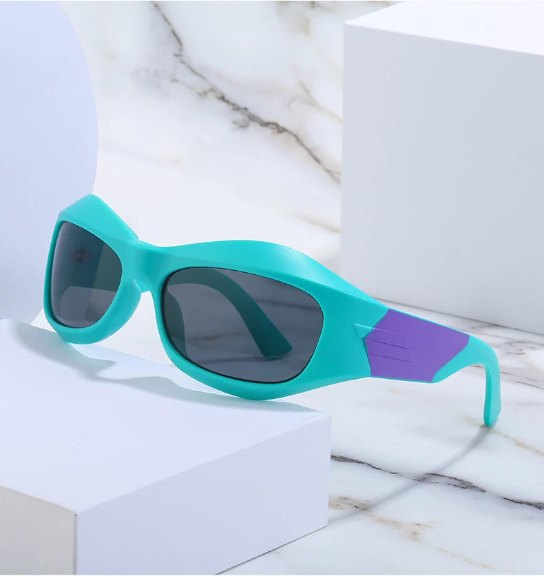 Teal and purple shield sunglasses on white podium