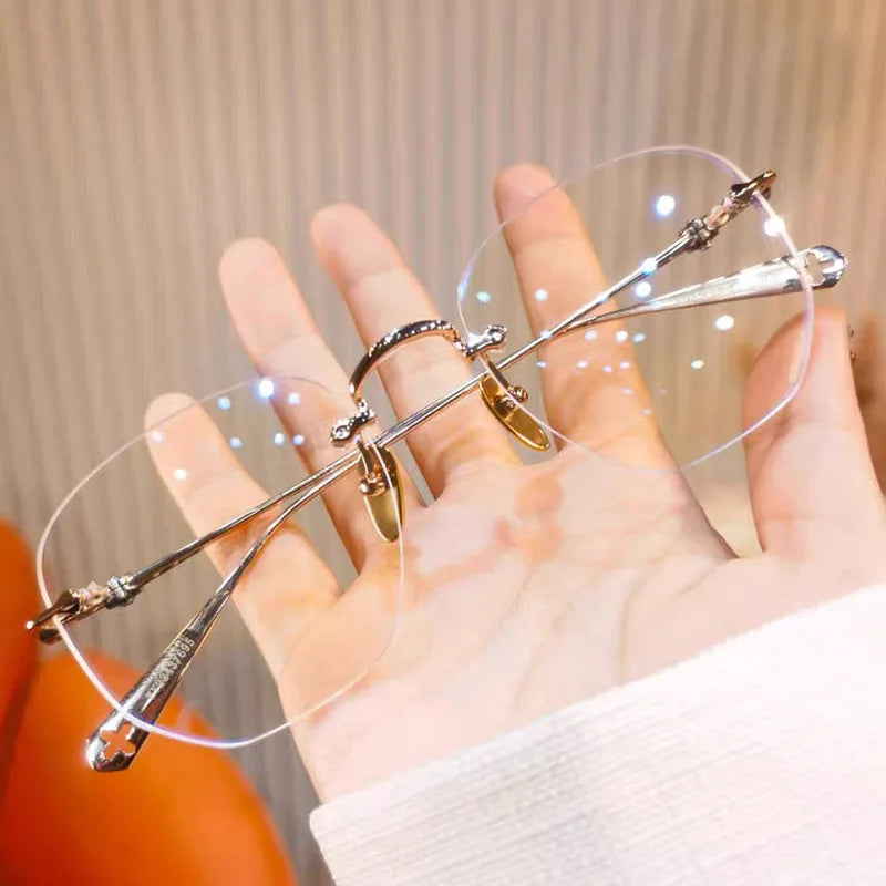 Palm holding frameless anti blue light glasses highlighting clear lenses and metal accents