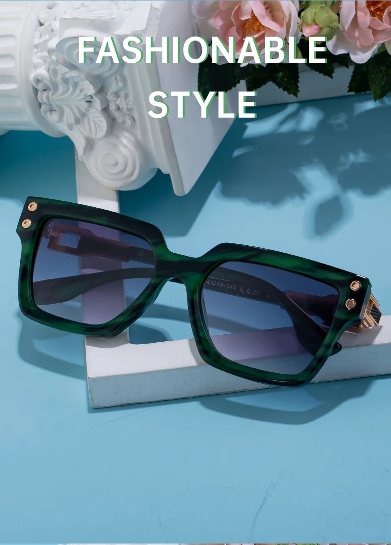Green marble square sunglasses with gold detail styled with decor