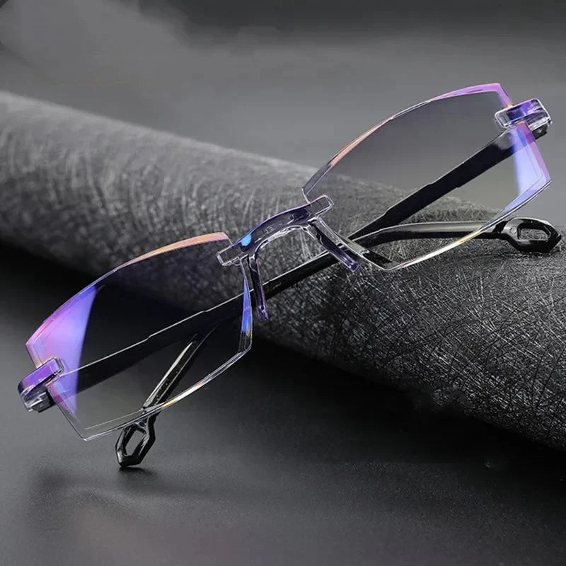 Rimless bifocal reading glasses with anti-blue light lenses on a dark background