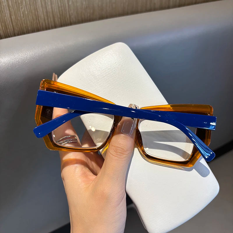 Folded blue orange glasses showcasing frame arms